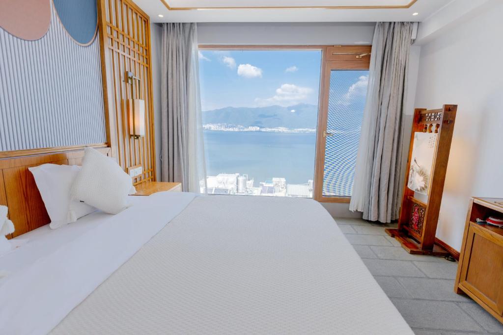 Postel nebo postele na pokoji v ubytování Dali Dare Sea View Gueshouse