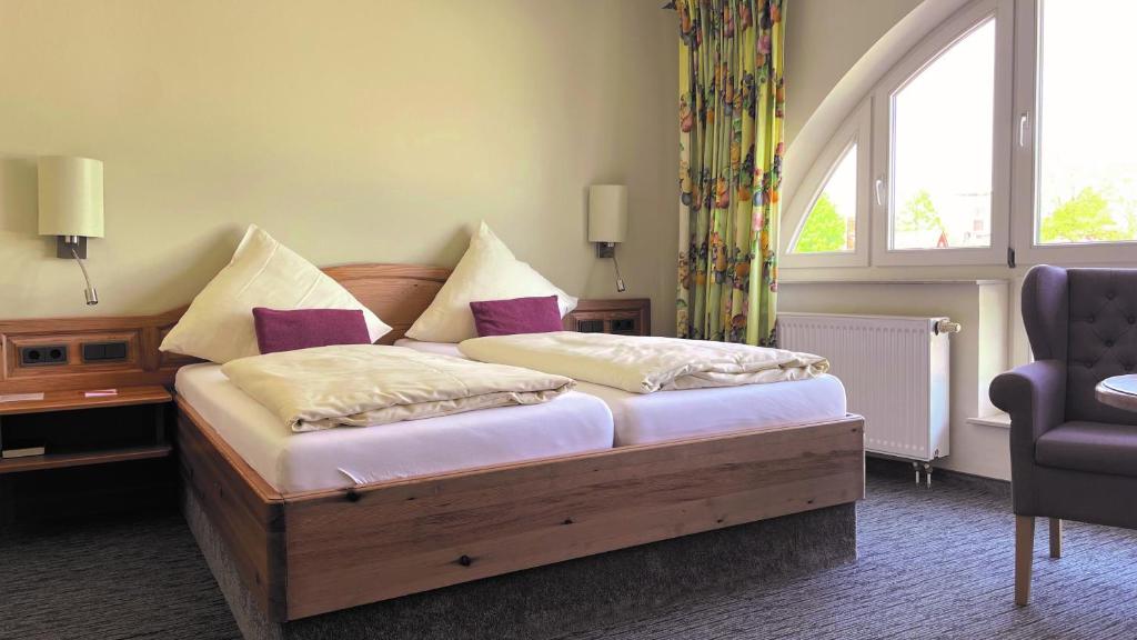Postel nebo postele na pokoji v ubytování Hotel Altes Stadthaus