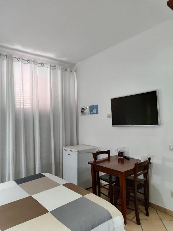 TV a/nebo společenská místnost v ubytování Bed and Breakfast Alberini
