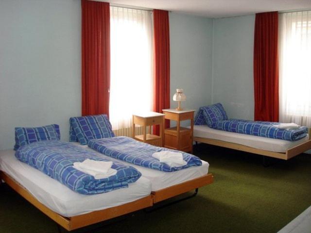 Postel nebo postele na pokoji v ubytování Hotel Quellenhof