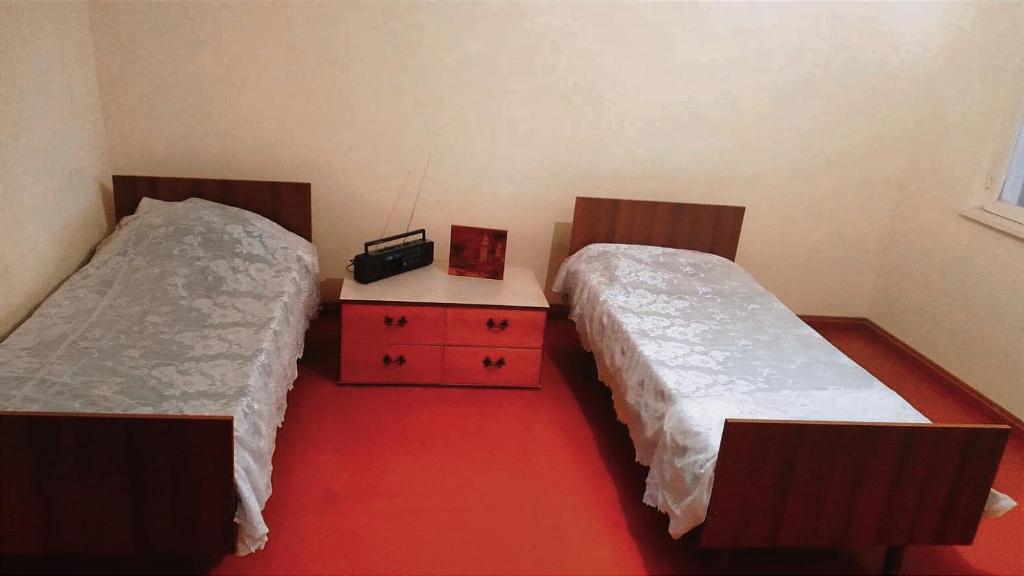 Voodi või voodid majutusasutuse Alen HOUSE toas