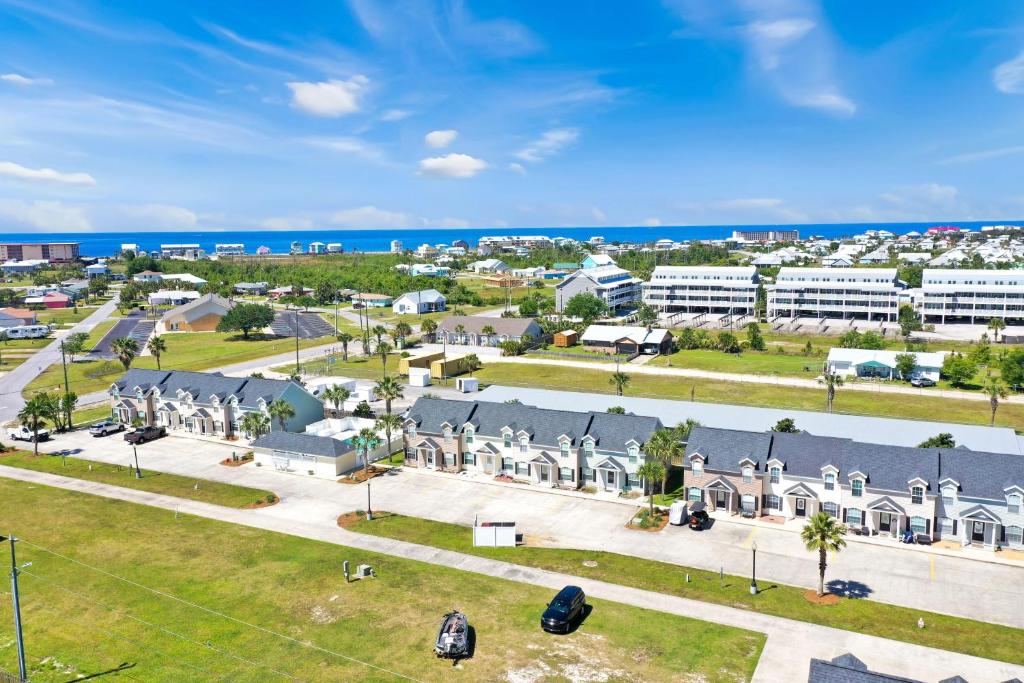 an aerial view of a city with buildings and the ocean at The Palms 2B by Pristine Property Vacation Rentals in Mexico Beach