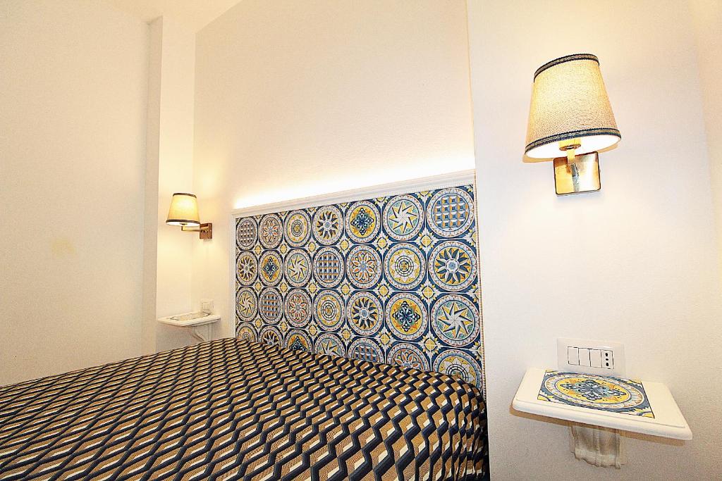 Łóżko lub łóżka w pokoju w obiekcie Casa Vacanze del Vicario