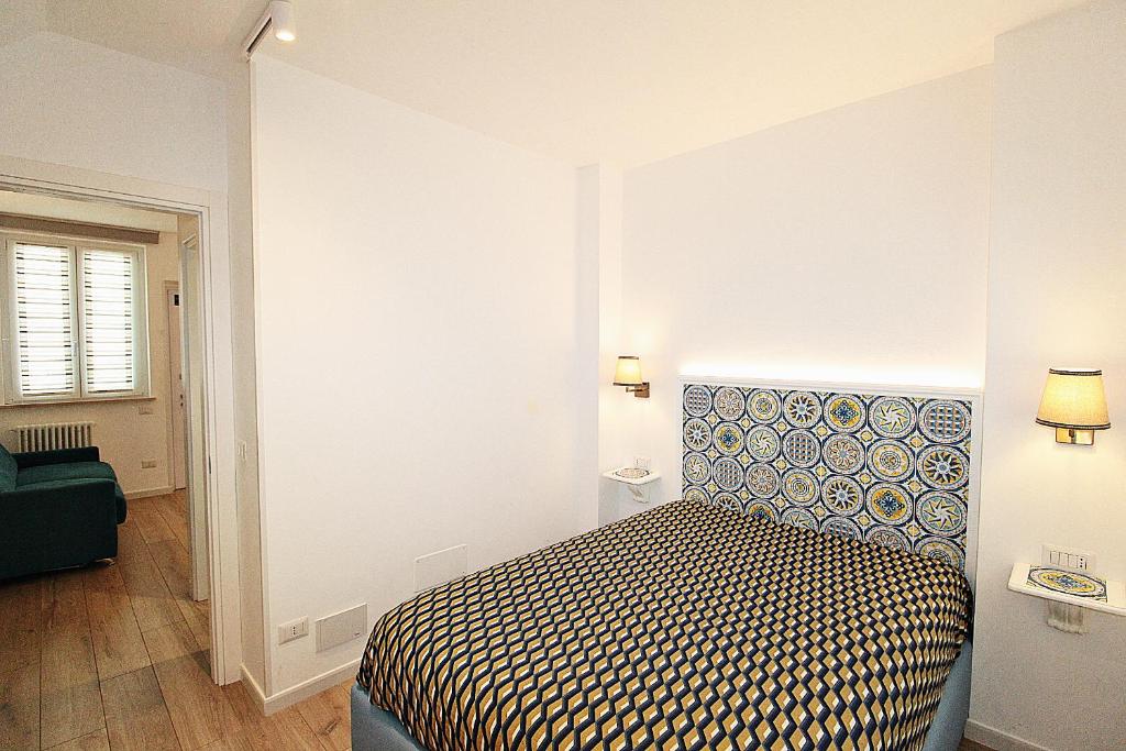 Łóżko lub łóżka w pokoju w obiekcie Casa Vacanze del Vicario
