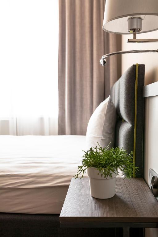 Posteľ alebo postele v izbe v ubytovaní Hotel Impresja