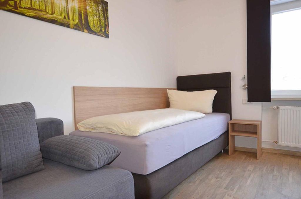 Postel nebo postele na pokoji v ubytování Gasthof Zur Schmiede
