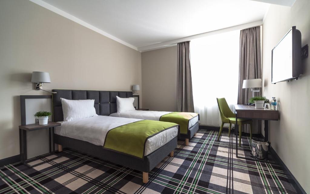 Posteľ alebo postele v izbe v ubytovaní Hotel Impresja