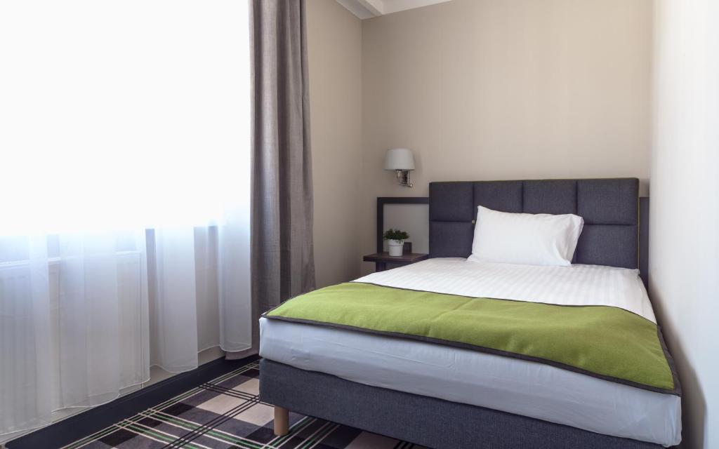 Posteľ alebo postele v izbe v ubytovaní Hotel Impresja
