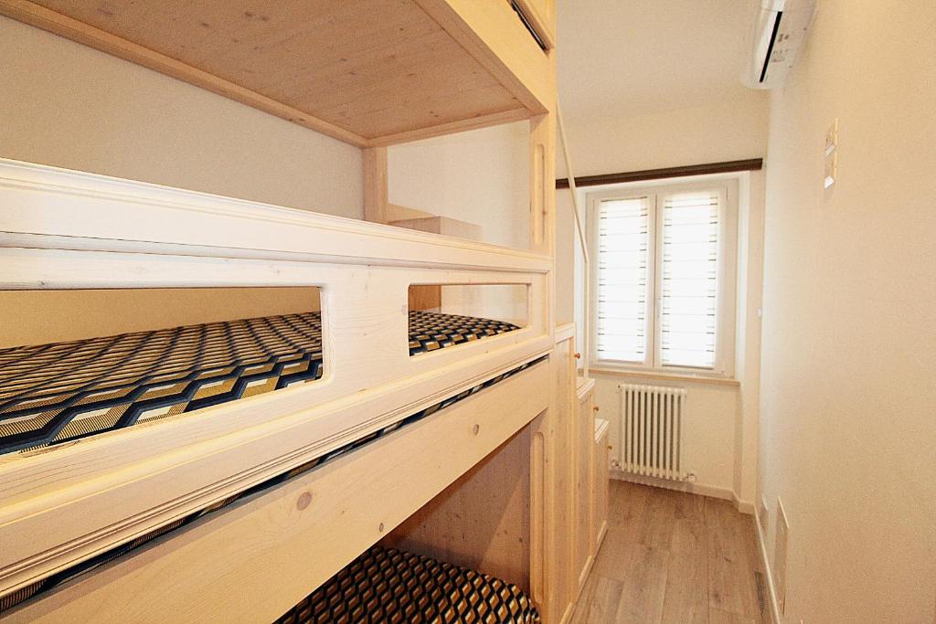 Łóżko lub łóżka w pokoju w obiekcie Casa Vacanze del Vicario