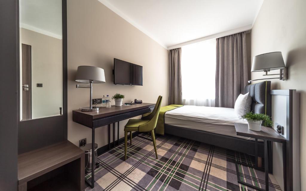 Posteľ alebo postele v izbe v ubytovaní Hotel Impresja