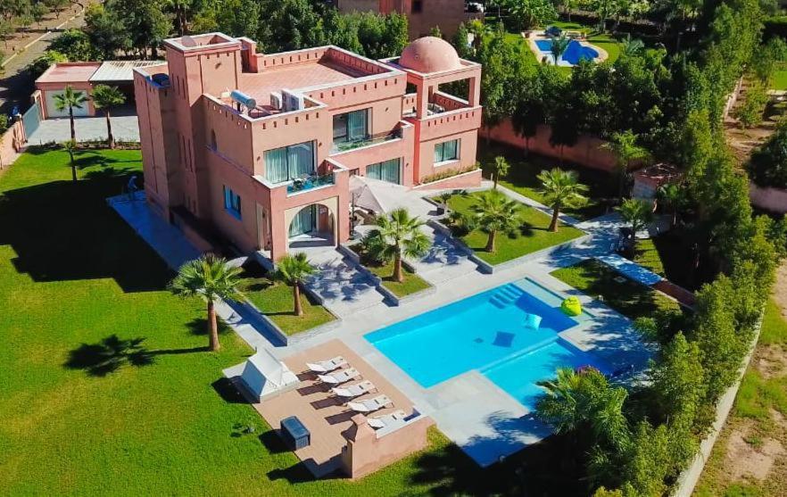 an aerial view of a house with a swimming pool at DAR KAYIS & LAILA in Marrakesh