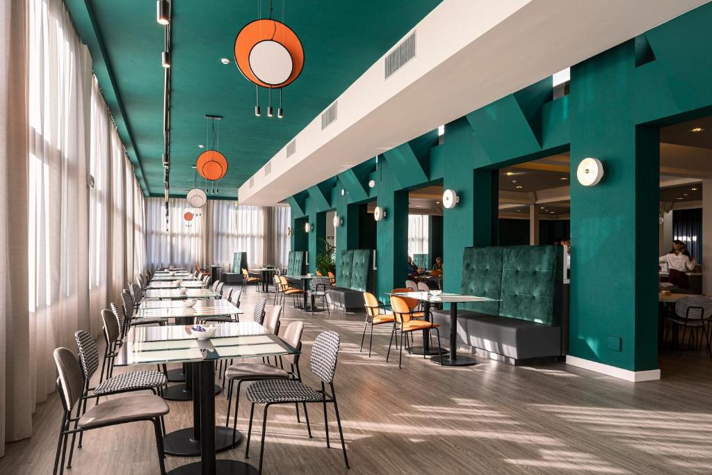 Um restaurante ou outro lugar para comer em Quark Hotel Milano