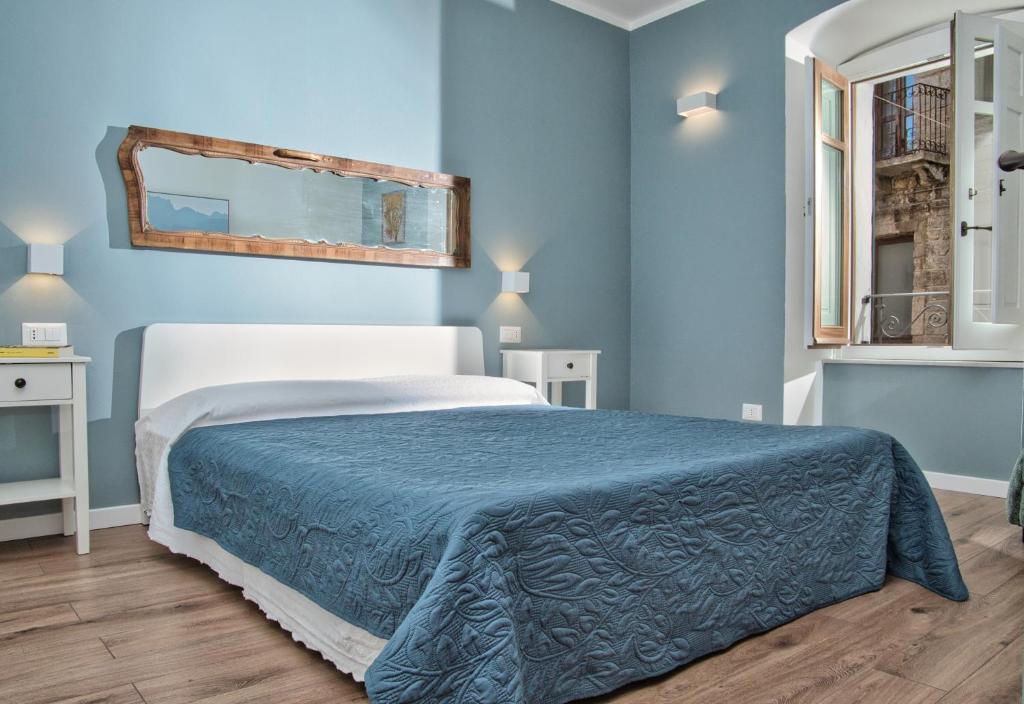 Postel nebo postele na pokoji v ubytování Suite In Piazzetta