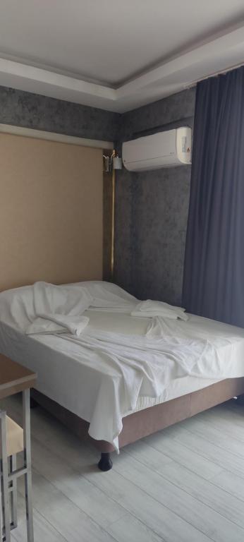 Postel nebo postele na pokoji v ubytování Emilia Otel