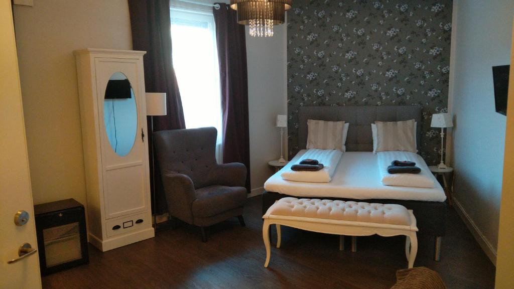 Postel nebo postele na pokoji v ubytování Hotel Charlotte / Stella
