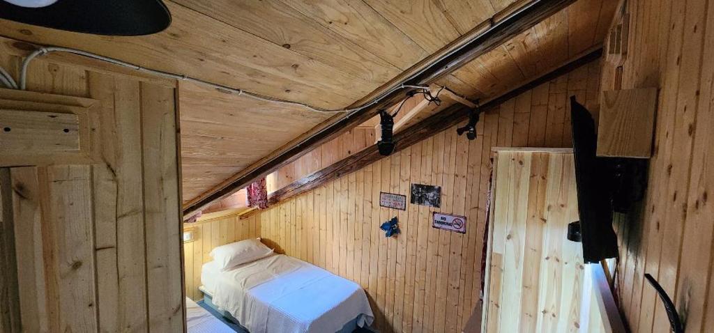 Postel nebo postele na pokoji v ubytování Hotel London