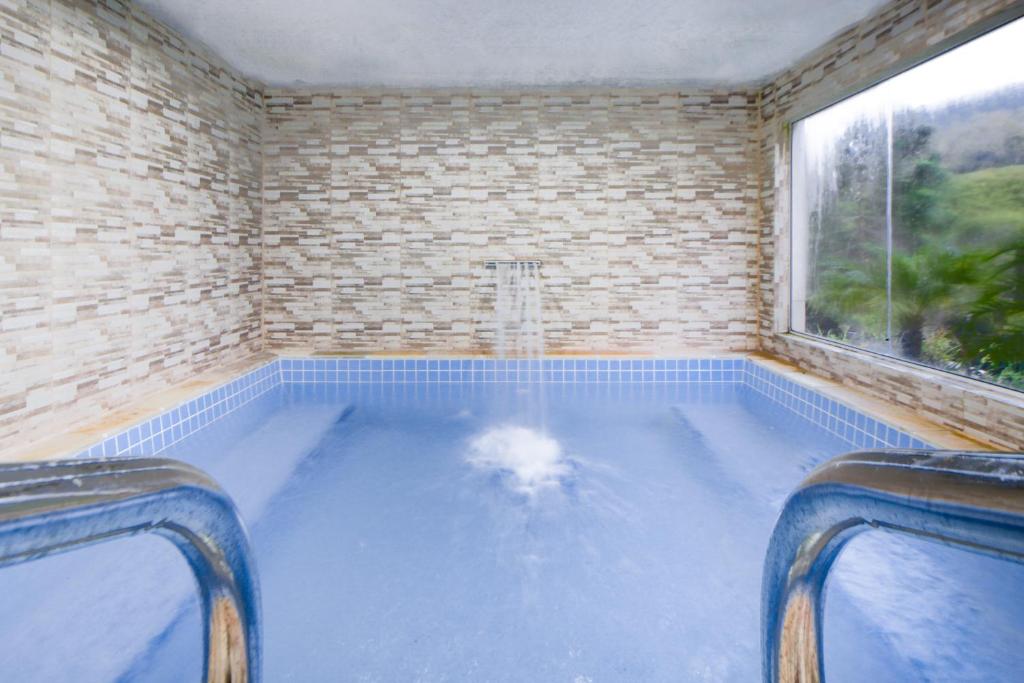 A piscina em ou perto de Pousada Highland