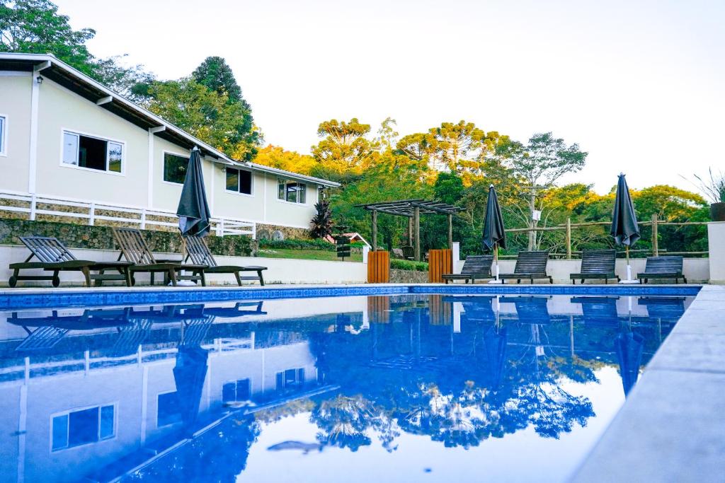 A piscina em ou perto de Pousada Highland