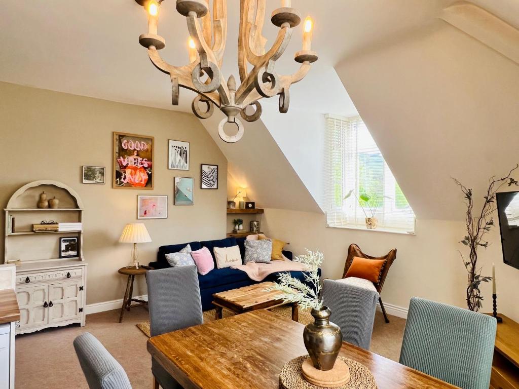 a living room with a couch and a table at Top floor double en-suite BR apartment central Matlock in Matlock