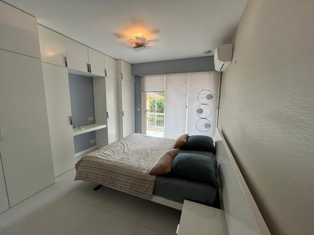Posteľ alebo postele v izbe v ubytovaní Appartement calme familial 3 ch avec terrasses