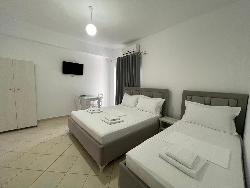 Posteľ alebo postele v izbe v ubytovaní Joni Apartments
