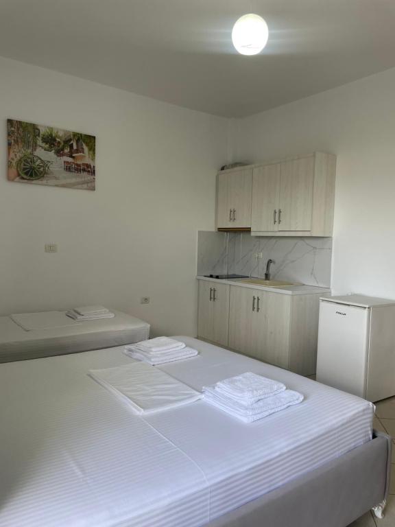 Posteľ alebo postele v izbe v ubytovaní Joni Apartments