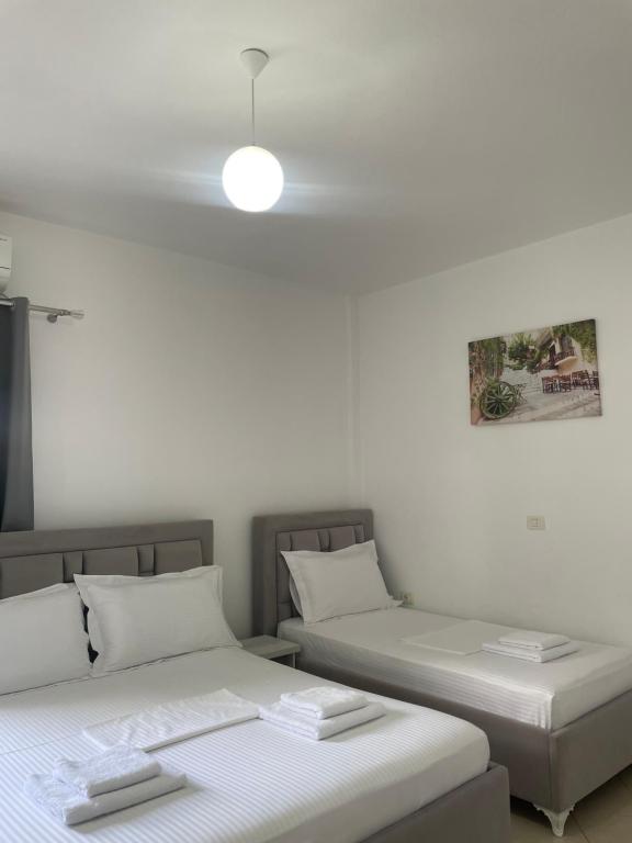 Posteľ alebo postele v izbe v ubytovaní Joni Apartments