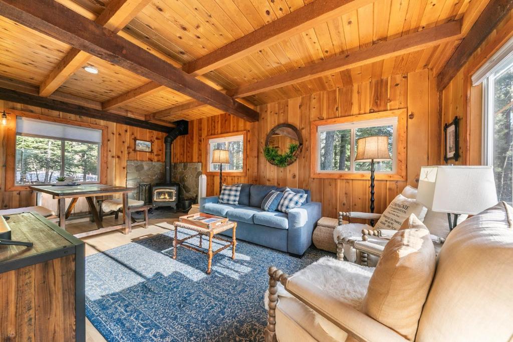 a living room with a couch and a table at 3BD Retreat - 5 Min to Beach Trails & Town in Carnelian Bay