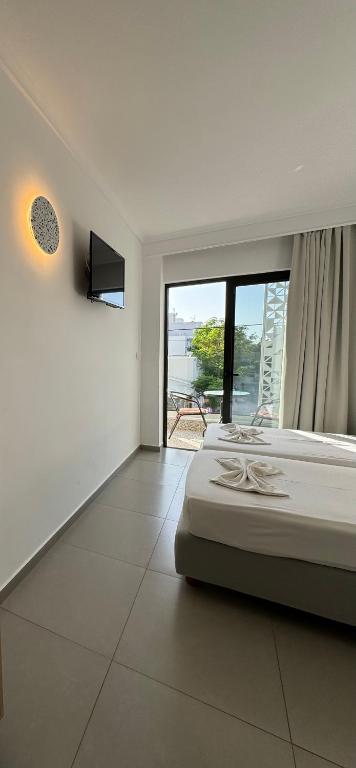 Postel nebo postele na pokoji v ubytování Catherine Hotel