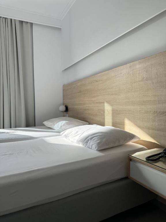Postel nebo postele na pokoji v ubytování Catherine Hotel