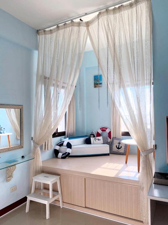 Postel nebo postele na pokoji v ubytování 澎湖藍海會館Blue Ocean Inn Penghu
