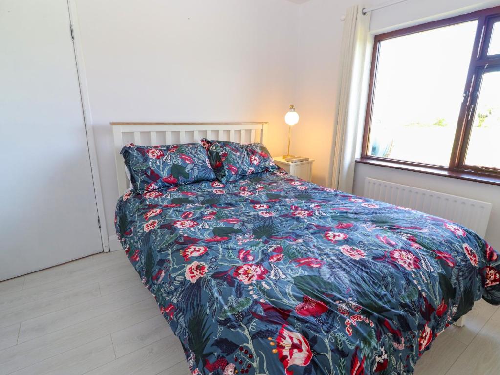 Postel nebo postele na pokoji v ubytování Tonakilla House