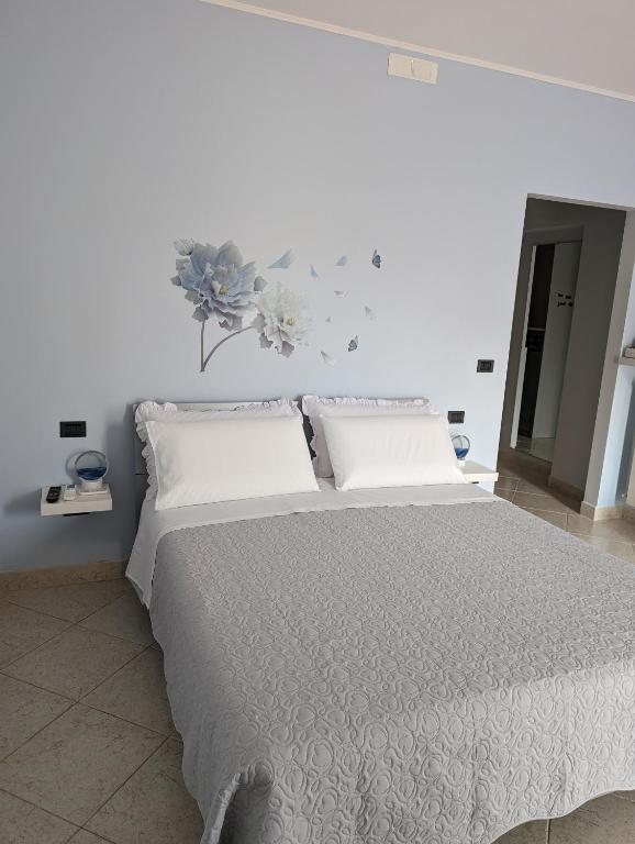 Postel nebo postele na pokoji v ubytování NULA Private Suites