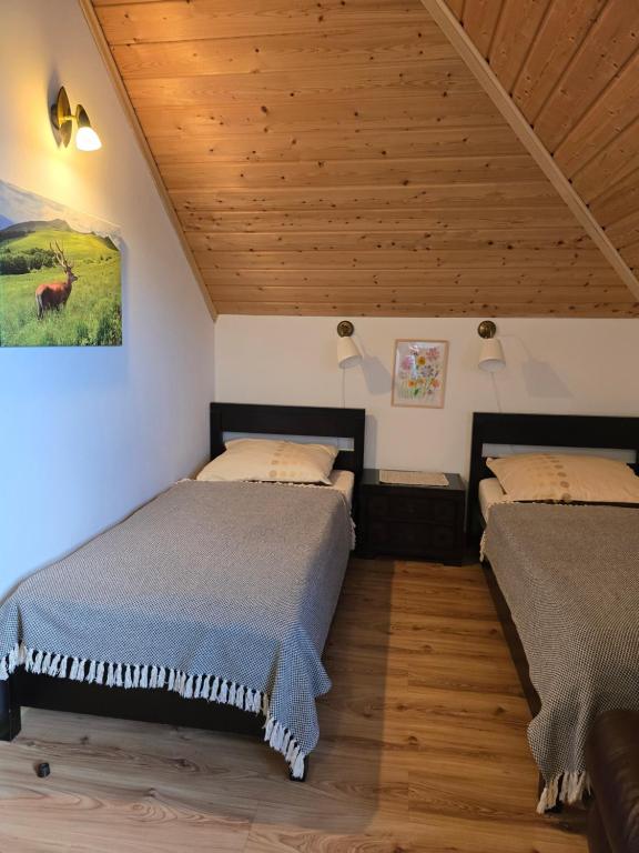 Postel nebo postele na pokoji v ubytování Grzechowisko