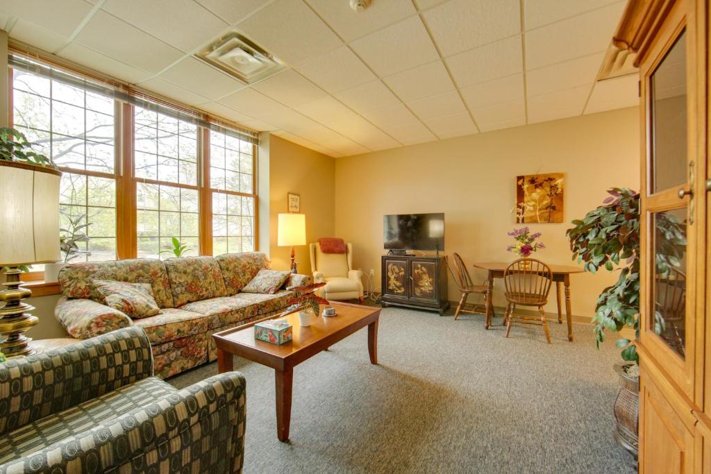 a living room with a couch and a table at New Kensington Vacation Rental with Shared Amenities in New Kensington