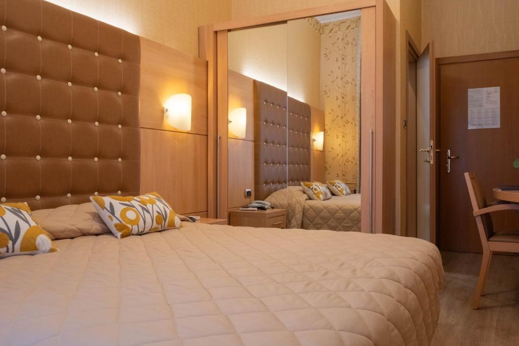 Postel nebo postele na pokoji v ubytování Hotel Vela D'oro ***S