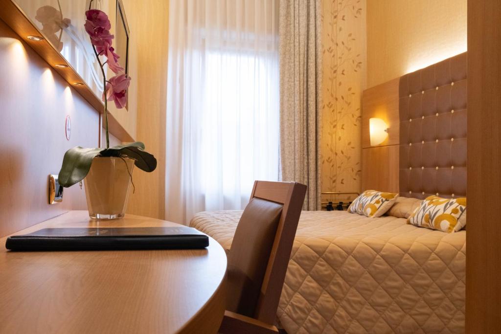 Postel nebo postele na pokoji v ubytování Hotel Vela D'oro ***S