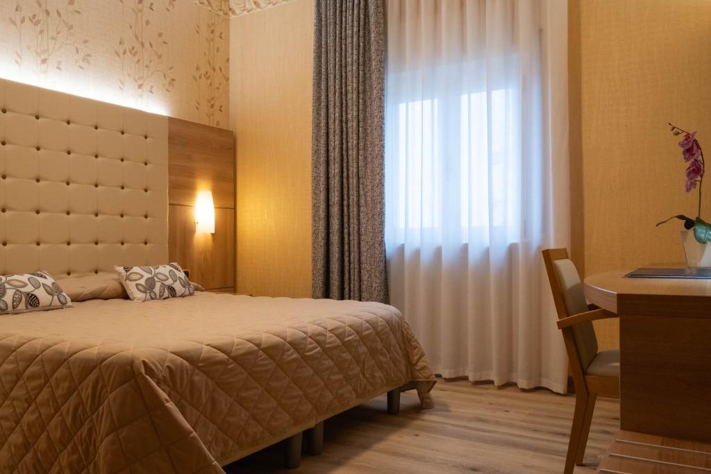 Postel nebo postele na pokoji v ubytování Hotel Vela D'oro ***S