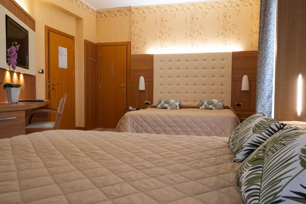 Postel nebo postele na pokoji v ubytování Hotel Vela D'oro ***S