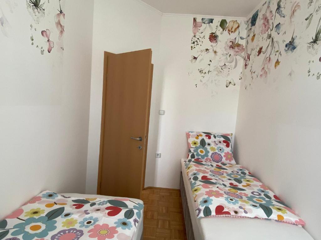 Postelja oz. postelje v sobi nastanitve Apartma ROGATEC