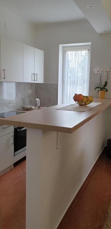 Kuchyň nebo kuchyňský kout v ubytování Apartments Karmen