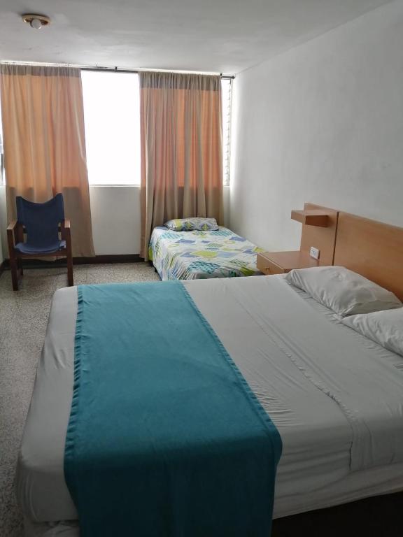 Postel nebo postele na pokoji v ubytování HOTEL del OESTE B&B