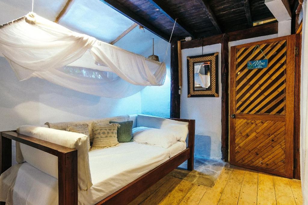 Postel nebo postele na pokoji v ubytování La Maison Eco House & Yoga