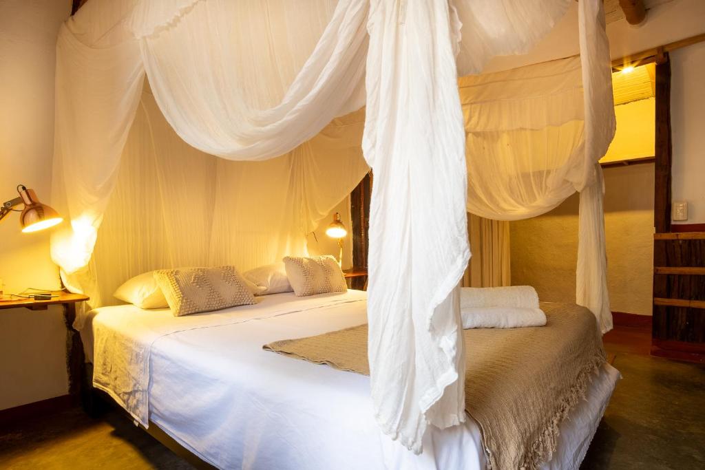 Postel nebo postele na pokoji v ubytování La Maison Eco House & Yoga