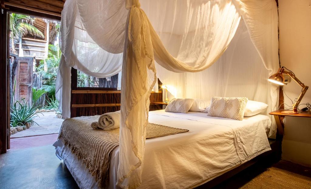 Postel nebo postele na pokoji v ubytování La Maison Eco House & Yoga