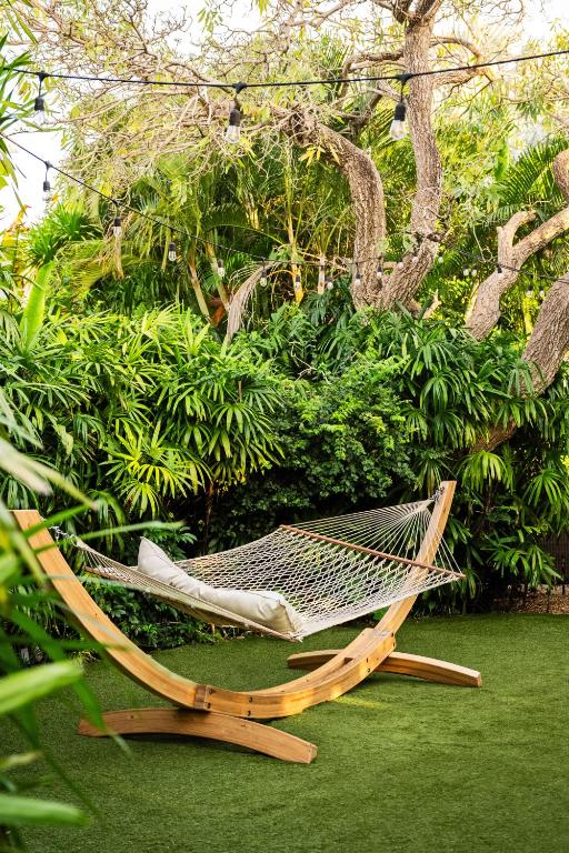 a hammock sitting on the grass in a garden at The Standard Miami in Miami Beach