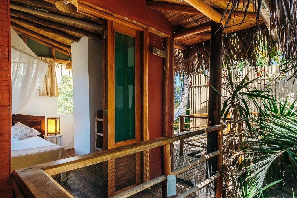 Postel nebo postele na pokoji v ubytování La Maison Eco House & Yoga