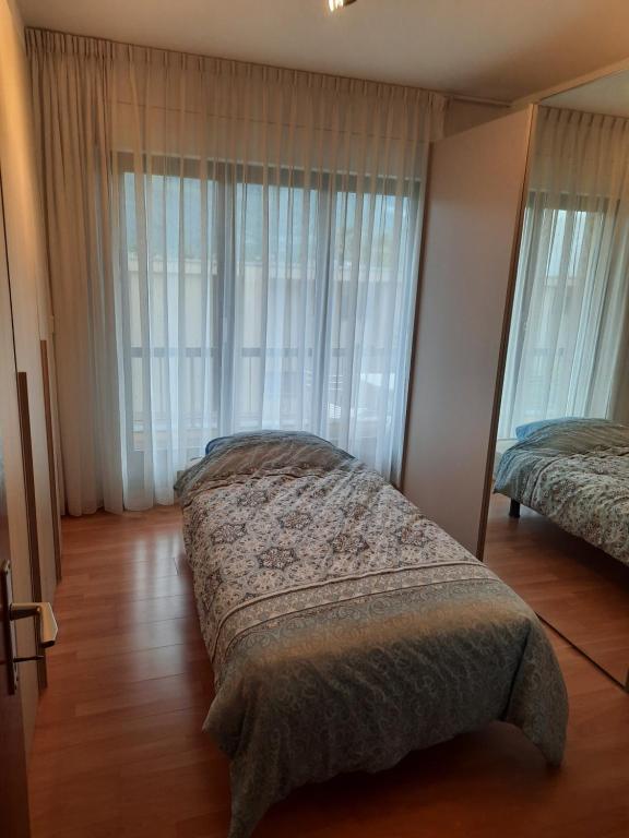 Postel nebo postele na pokoji v ubytování Camera privata con balcone