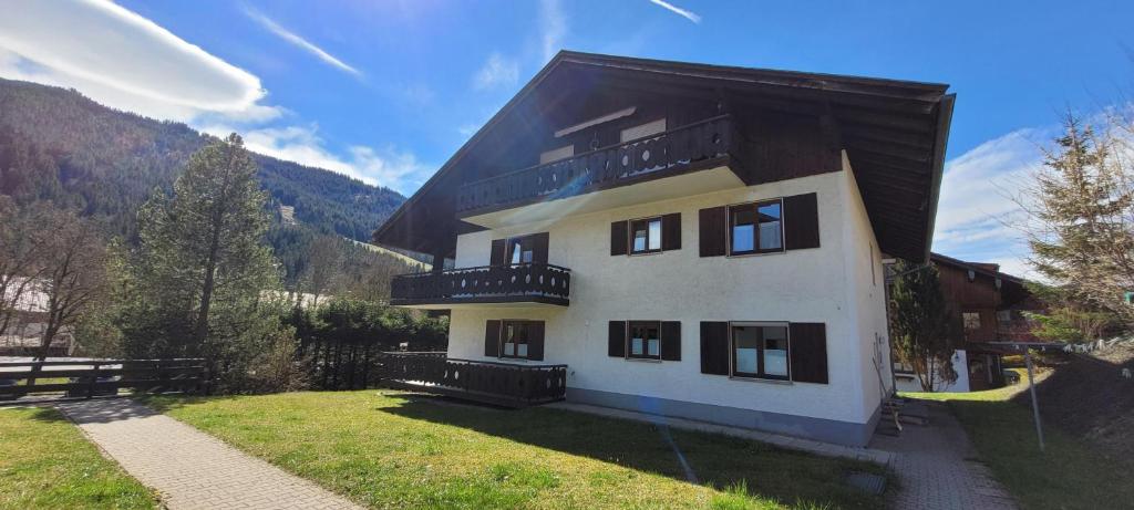 a large white building with a black roof at Allgäu Alps in Liebenstein