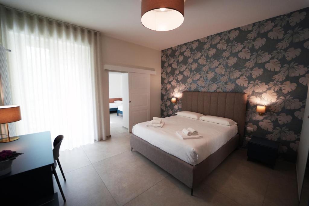 Postel nebo postele na pokoji v ubytování Annunziatella Suite & Rooms